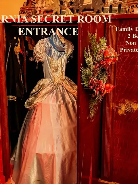 The entrance to the Narnia Suite, through a wardrobe